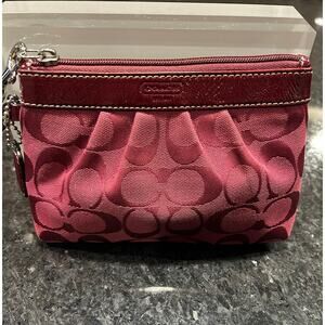 Coach Signature C's
Canvas/Patent Leather Burgundy Red Wristlet